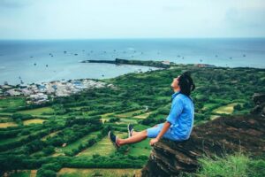 happy-man-on-cliff